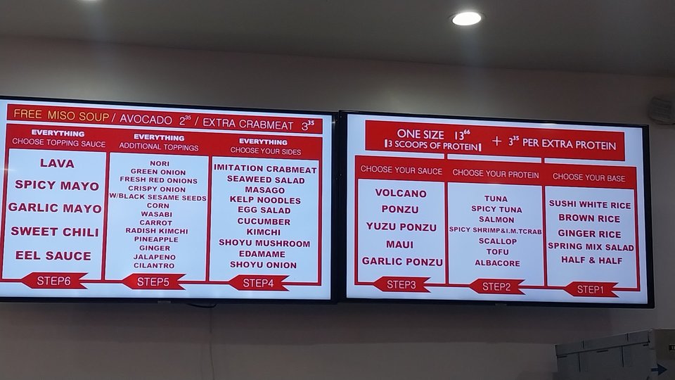 Casual restaurant seating beside a prepared bowl display
